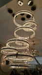 Contemporary chandelier created by grouping several pendants of different sizes. Great effect. #Lighting