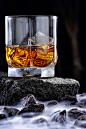 Glass of whiskey in fog .Advertising shotd : Concept advertising alcohol in landscape.Fog