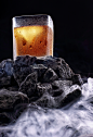 Glass of whiskey in fog .Advertising shotd : Concept advertising alcohol in landscape.Fog