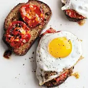 — Charred Tomatoes with Fried Eggs on Garlic Toast