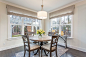 Beach style dark wood floor dining room photo in Richmond with gray walls