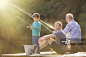 Boy, father and grandfather fishing on wooden dock - 创意图片 - 视觉中国