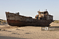 Uzbekistan, Moynaq, rusty boat beached in the desert which used to be the Aral Sea