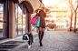 Fashionable woman and her border collie dog making shopping in t