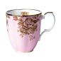 The 1960 Golden Roses Mug is decorated with the pattern's signature rose design, detailed in gold on a stunning pink background.