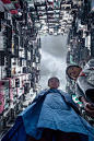 2014, Hong Kong, Hong Kong Island. My take on this famous apartment complex in Quarry Bay.  These siblings were so kind to be my models for the shot. Camera was on the ground, facing up, and triggered via WiFi from the smartphone app.