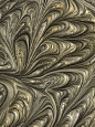 Gold and silver marbled paint pattern