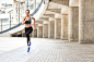 Confident fit girl jogging outdoors