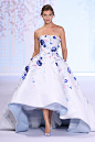Spring Summer 2016 : White silk gazar ball gown with pale blue lining and hand painted floral design, embellished with crystal and glass bead 3D petals.