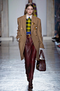 This image may contain Jelena Noura Gigi Hadid Clothing Apparel Coat Overcoat Human Person and Female