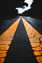 long exposure photo of yellow lines on road