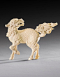 A CARVED IVORY FIGURE OF A QILIN, CHINA, QING DYNASTY, QIANLONG PERIOD (1736-1795): 