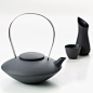 Tea pot, and set of milk jug and sugar bowl  in frosted, unglazed black china by Ditte Fischer.