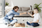 tutor-boy-playing-chess-floor