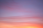 Colorful sunset with hazy clouds in the sky