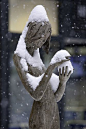elegant snow covered statue