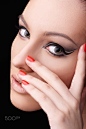 Glamour make up arrow and  red nail art