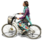 A young woman in a colorful dress riding a citybike
