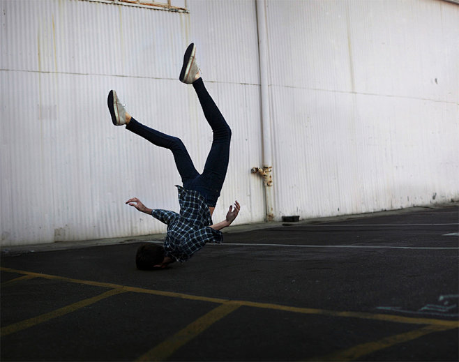man upside down by b...