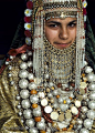 Yemenite Jewish girl, Irit Kapach, wearing golden ceremonial dress and gold and silver jewelry. Goldsmiths and other craft people are among the Jews who emigrated to Israel from Yemen. Yemenite Jewish brides in a traditional wedding ceremony may wear this