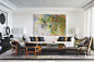 Curved Ceiling in the Pale Master Bedroom : The master suite upstairs also has a sense of variety, as if valued pieces gathered from around the world and through the decades have come together. A gilded iron chandelier lights the space with its rugged woo