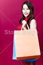 Smiling young asian woman holding the  shopping bags#新年# #灯笼# #春节# #过年# #中国传统# #中国风# #新年装饰# #元宵节# #春节装饰# #红灯笼# #中国年# #春节素材# #新年素材# #年货# #喜庆# #中国红# #新年快乐# #元宵节# #新年海报# #新年设计素材# #新年红包# #平面设计# #白背景# #打折# #购物# #旗袍美女# #折扣# #礼品盒# #新年礼物# #新年美女# #新年儿童# #果盘# #舞狮# 
