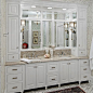 Bathroom - traditional bathroom idea in Minneapolis with an undermount sink, raised-panel cabinets, white cabinets, granite countertops and beige countertops