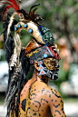 Mayan Warrior in traditional dress, performs an ancient ritual dance: