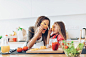 Mother and daughter having fun with the vegetables