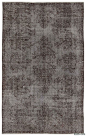For a contemporary look with abstract appeal, this grey over-dyed rug is skillfully crafted by the revitalization of a hand knotted vintage Turkish rug. Made from wool on cotton, this “distressed” rug measures 5'9'' x 9'2'' (69 in. x 110 in.). The process