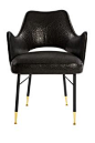 KELLY WEARSTLER | RIGBY CHAIR.  Black leather chair with a blackened steel base with solid bronze sabots.