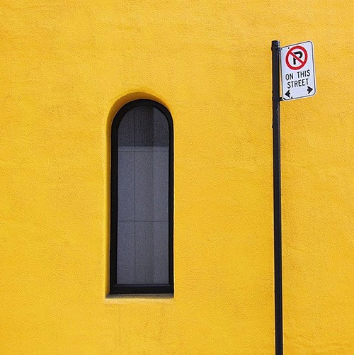 window in yellow wal...