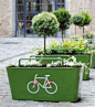 double duty: planters with trees to lock our bike. More than a landscape idea, it's a urban intervention idea. Beautifully done.