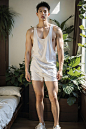 A handsome asian boy, huge muscles, wearing golden lingerie, standing, full body photo, designer sneakers, sunny, in the room, blurred light, soft light, warm color, hd big picture, green plants, 4k, man, man, boy, man, man, man