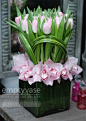 Clean and modern arrangement with #pink orchids and tulips.