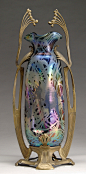 Art glass included a wild Wilhelm Kralik Sohn vase supported by a wonderful Art Nouveau metal surround.