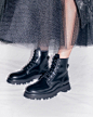 Photo by Alexander McQueen on March 13, 2021. May be an image of boots.