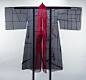 "Durumagi" by Chunghie Lee, now in the| V&A. "Red and black silk, full-length robe with wide, square-shaped sleeves and trailing threads at hem.Korea, 2000. Part of the April, 2001 "Fashion in Motion" exhibit, donated by the d