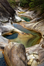 gray and brown rock formation on body of water