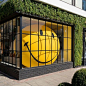 A blow-up smiley face in the window at Anya Hindmarch's new L.A. store | archdigest.com