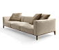 Aton by Giorgetti : A series of armchairs and sectional sofas with the base frame and the feet in solid walnut canaletto wood (fin.11) and the back and the armrests in poplar plywood. The padding is in goose feathers wit…