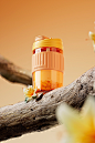 其中可能包括：an orange pill bottle sitting on top of a tree branch next to some yellow flowers