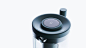 a close up view of the top of a coffee maker on a white background with no one around it