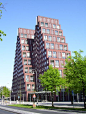 In the mixed area between the dense inner city of Amsterdam and the post-war quarters in the east of Amsterdam, architect Sjoerd Soeters designed this double pyramid. The pyramid is programmed with apartments, on top of a plinth with retail.