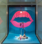 VM example of SCALE, COLOR, CONTRAST and LIGHTING. Large mouth, bright pink catches the eye which contrasts with the blue background and the spotlight highlights the product on the ground and draws the eye there. The product placement also creates a line