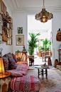 Moroccan living room with a gorgeous custom star pendant, handmade tapestries and some leather poufs. #Moroccan #Lanterns #interiors #interiordesign #Decor #Moroccandecor.