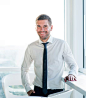 Portrait of a happy businessman standing in office
