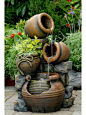 The Potted Water Fountain With Planter is the perfect corner water feature for any space. Featuring multiple tiers of falling water and an adorable little plant: 