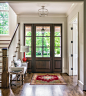 Inspiration for a timeless dark wood floor entryway remodel in Nashville with gray walls and a glass front door