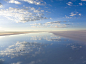 Photo: Vehicles driving over salt flats in Salar de Uyuni, Bolivia